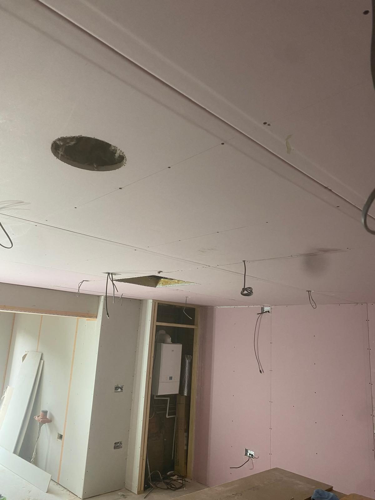 Boxed-in boiler cupboard with drylining